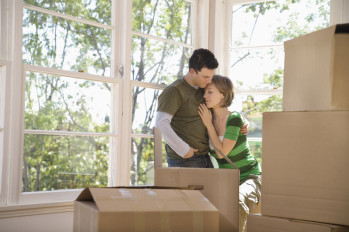 Couple in a new home with boxes